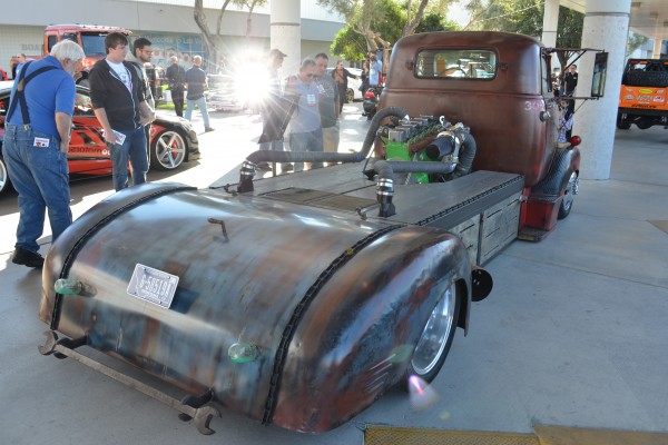 vintage GMC flatbed hauler with cummins diesel in back