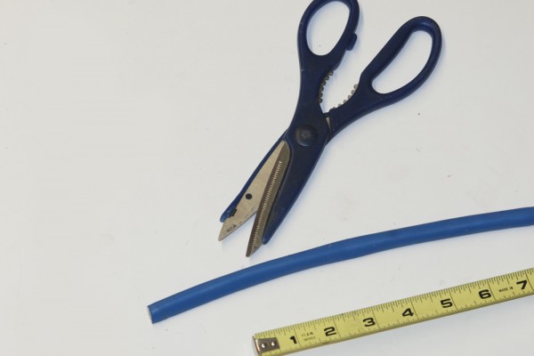 scissors, measuring tape, and a ignition spark plug wire