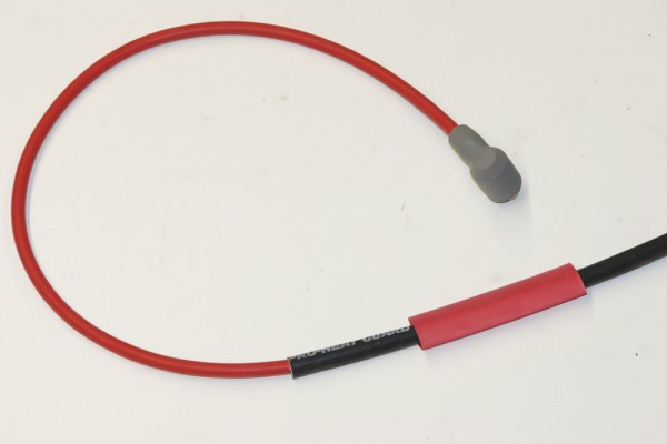 slipping heat shrink sleeve down to a terminal on a spark plug wire