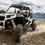 Polaris RZR XP 4 1000 driving on desert mountain trail