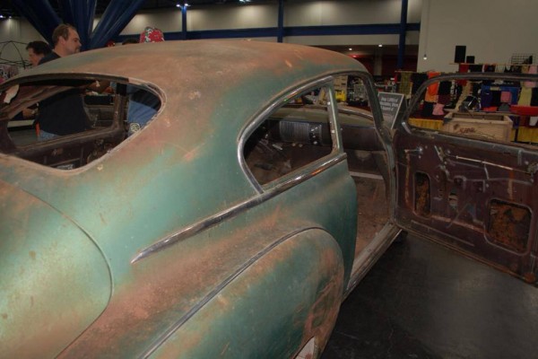 an old chevy coupe getting turned into a hot rod