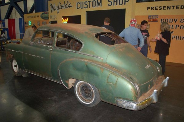a vintage car getting read to be turned into a hot rod