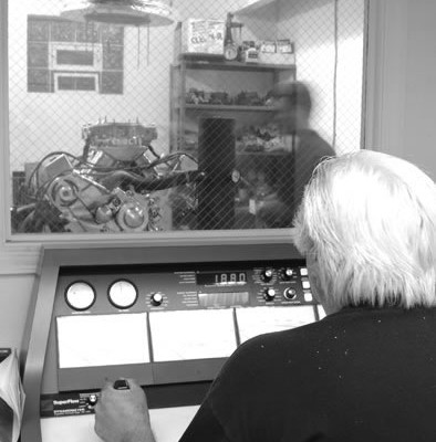 man at the controls of an engine dyno