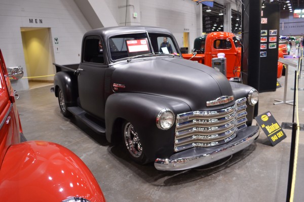 1948 Chevy 3100 pickup truck on display at indoor car show