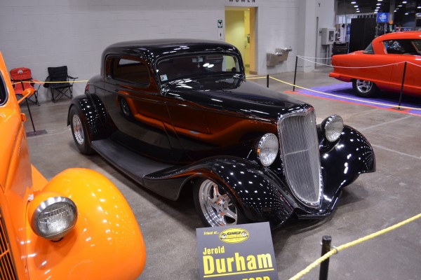 1934 fendered ford coupe on display at indoor car show