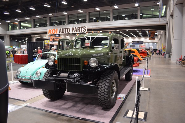 Green Dodge Power Wagon Four Door on display at indoor car show