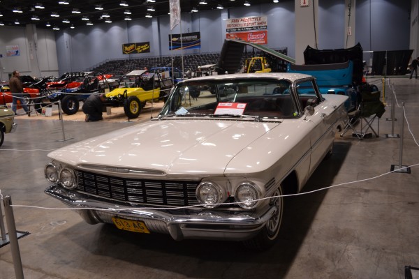 vintage white sedan At Indoor Car Show