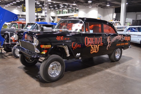 1955 chevy nostalgia gasser hot rod displayed at indoor car show