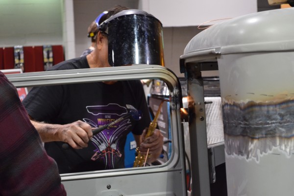 Gene Winfield welding a door frame on a hot rod