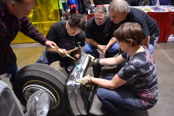 Gene Winfield teaching metal work to students