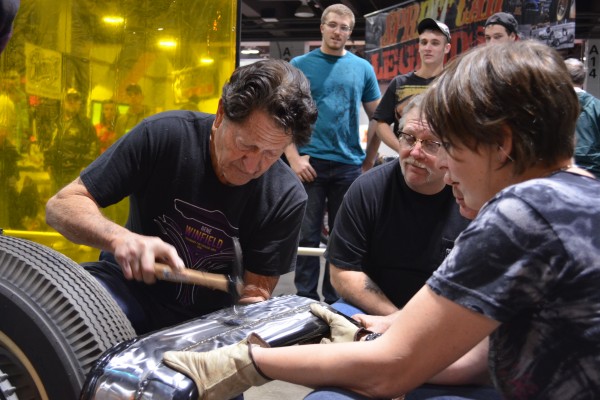 Gene Winfield teaching metal work to students