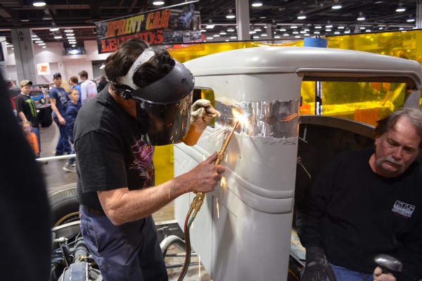 Gene Winfield welding the roof of a hot rod truck