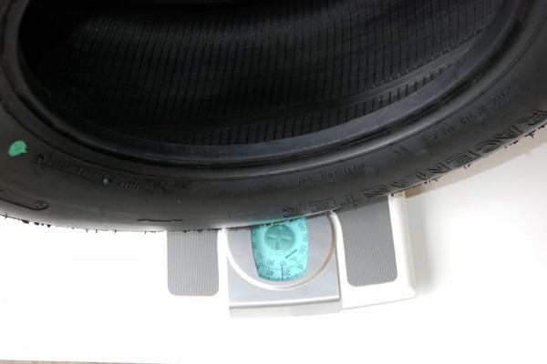 weighing a drag radial tire on a scale