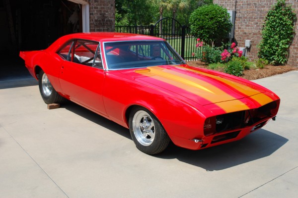 pro street 1967 chevy camaro drag car in home driveway