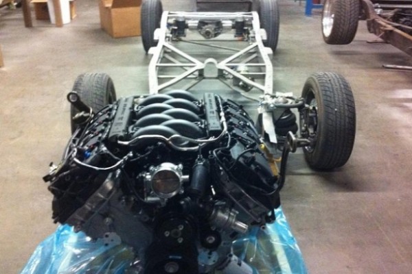 ford coyote v8 near a bare vehicle frame