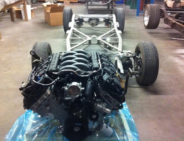 ford coyote v8 near a bare vehicle frame
