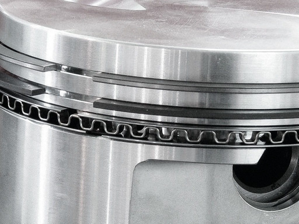 close up of piston rings in groove land
