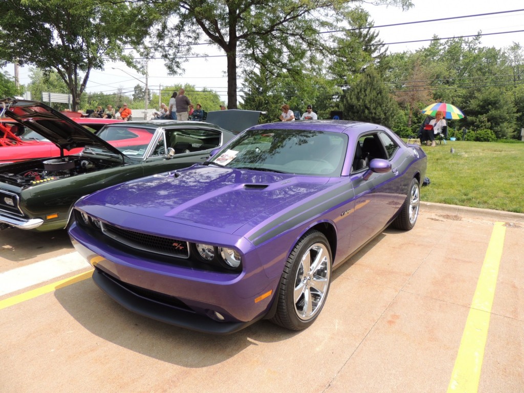 plum crazy late model dodge challenger at car show