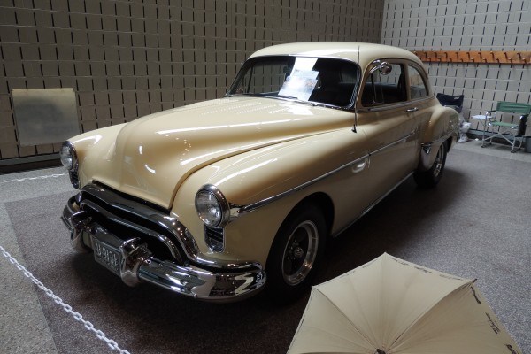 Postwar chevy coupe with custom wheels