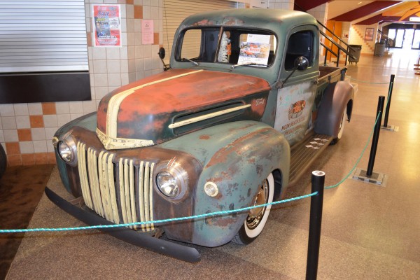 Vintage Ford F-1 pickup truck in original patina at car show