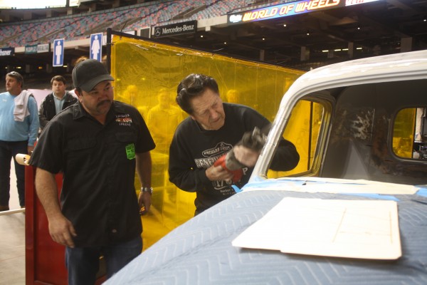 gene winfield sawing through a roof pillar to modify a hot rod