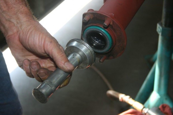 seating an axle bearing in a tube