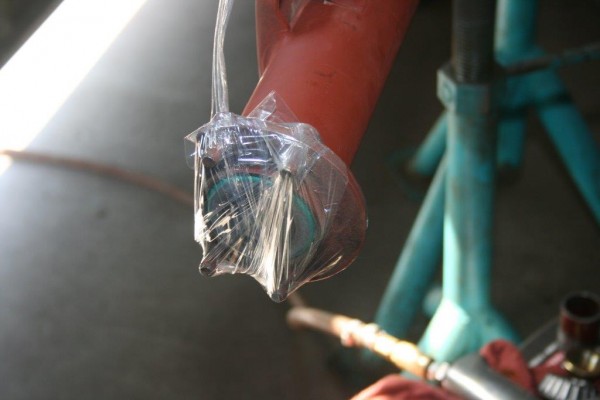a wrapped end of an axle housing tube