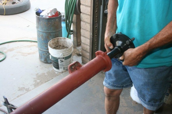 inserting axle into axle housing tube