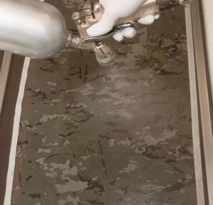 man spray chemical activator into a water vat