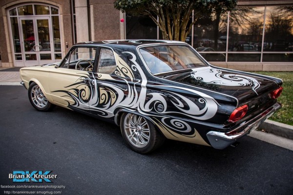 rear view of a vintage plymouth with custom paint and graphics