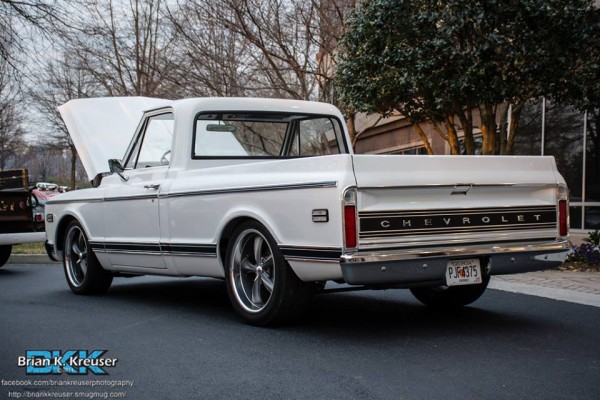rear tailgate view of a white chevy c10 truck