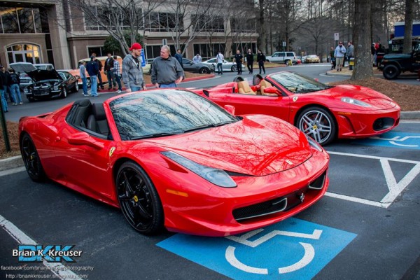 a pair of Ferrari sports cars at a cruise in car show