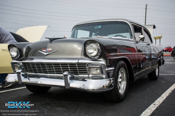 black 1956 chevy post coupe with custom wheels