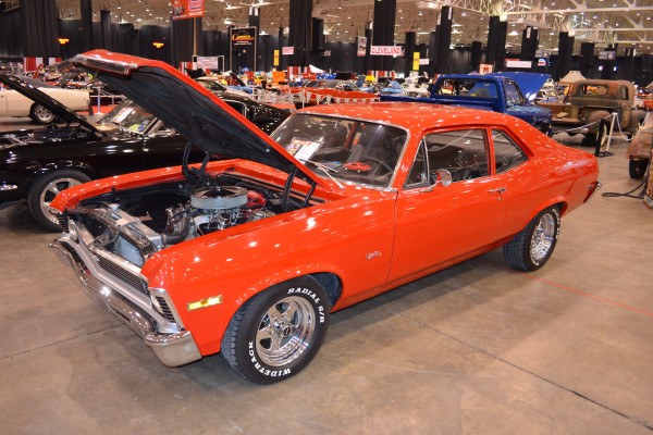 orange chevy nova muscle car with weld wheels