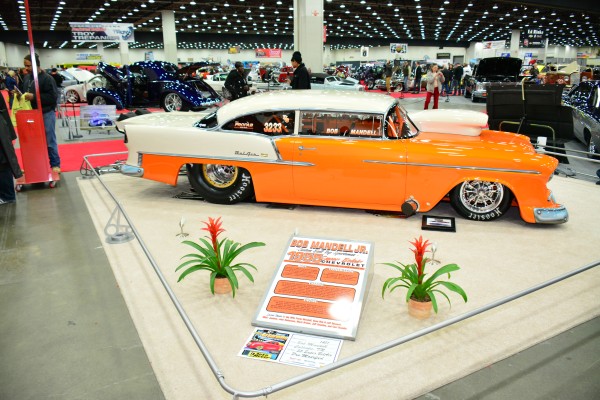 1955 chevy bel air drag car on display at indoor car show