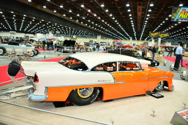 1955 chevy bel air fiberglass drag car on display at indoor car show