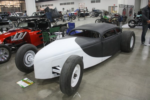 salt flats style hot rod on display at indoor car show