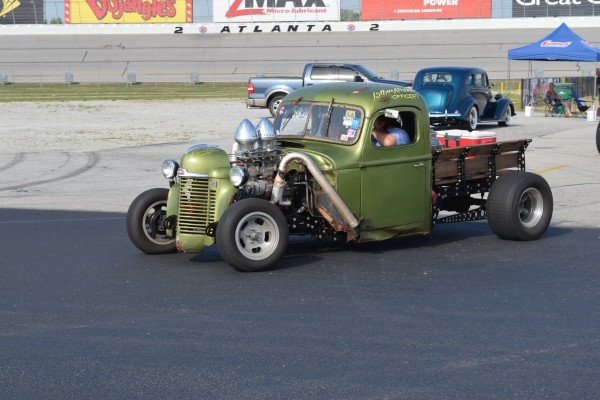 vintage rat rod pickup truck with supercharged v8