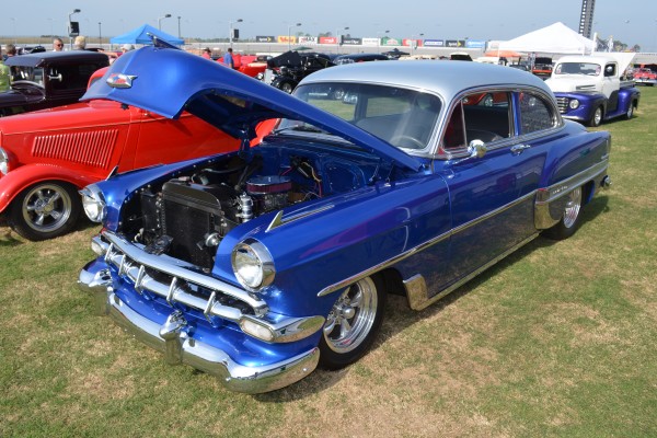 vintage chevy coupe lowrider with custom paint and wheels