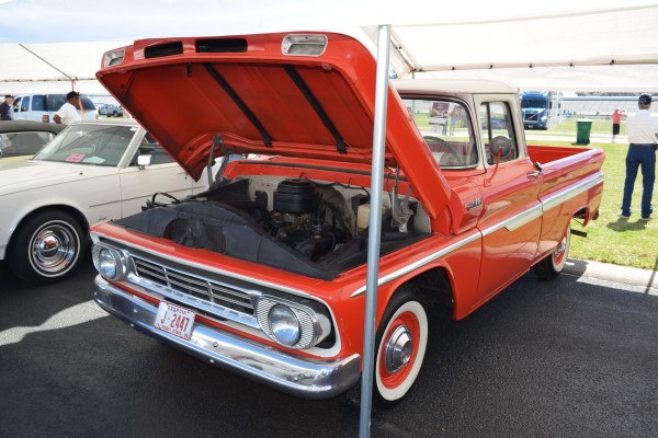 vintage chevy c10 truck at a car show