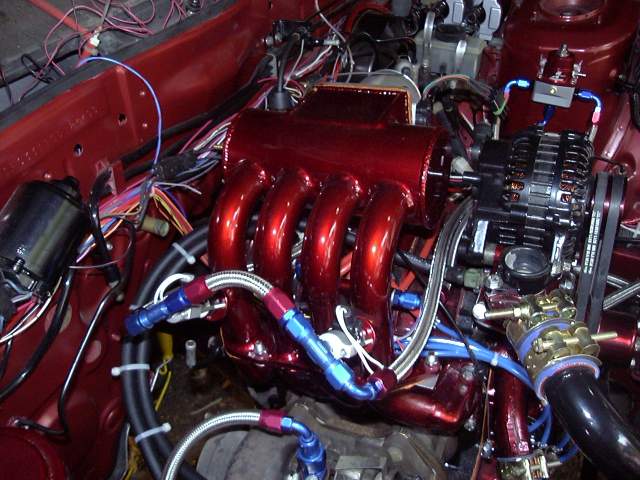 engine bay of a vintage hot rod