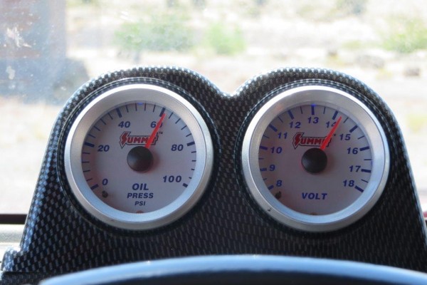 a pair of summit racing oil pressure and voltmeter gauges installed