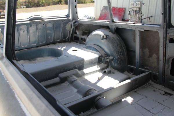 bare interior of a classic car body prior to paint