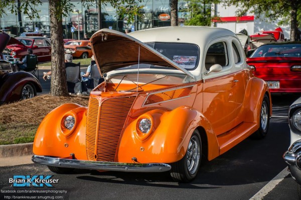 vintage prewar hot rod parked at a car show