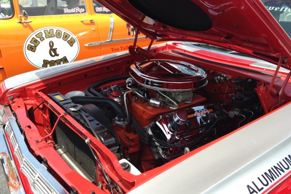 426 race hemi engine with cross ram intake in a classic mopar