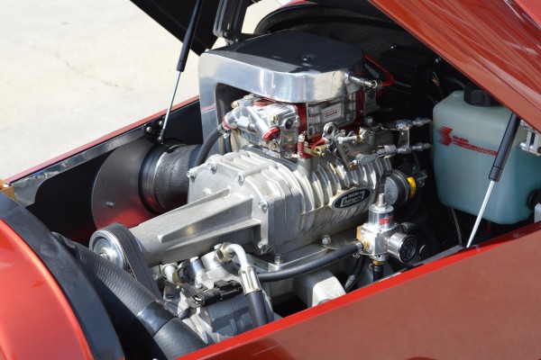 supercharged v8 engine in a vintage hot rod