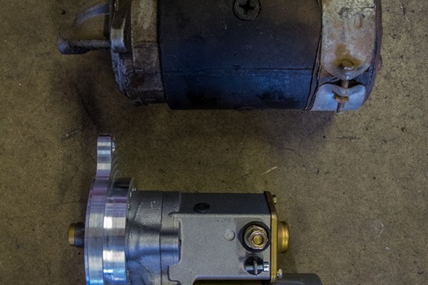 a side by side comparison of old and new engine starter motors