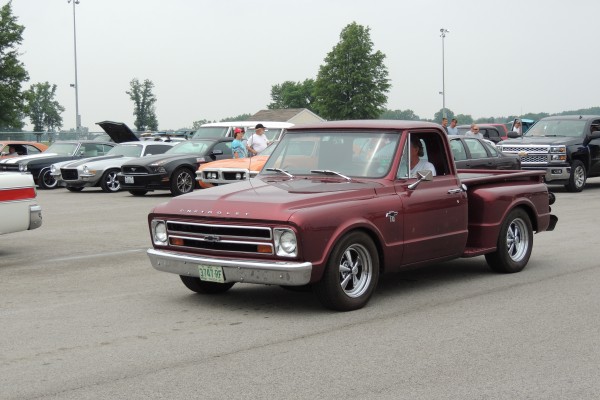 chevy c10 custom pickup truck entering a car show