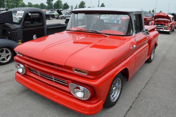 vintage red chevy pickup truck with custom paint and wheels