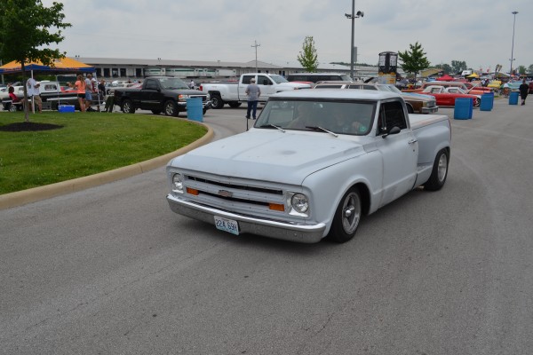 vintage chevy pickup truck entering a car show